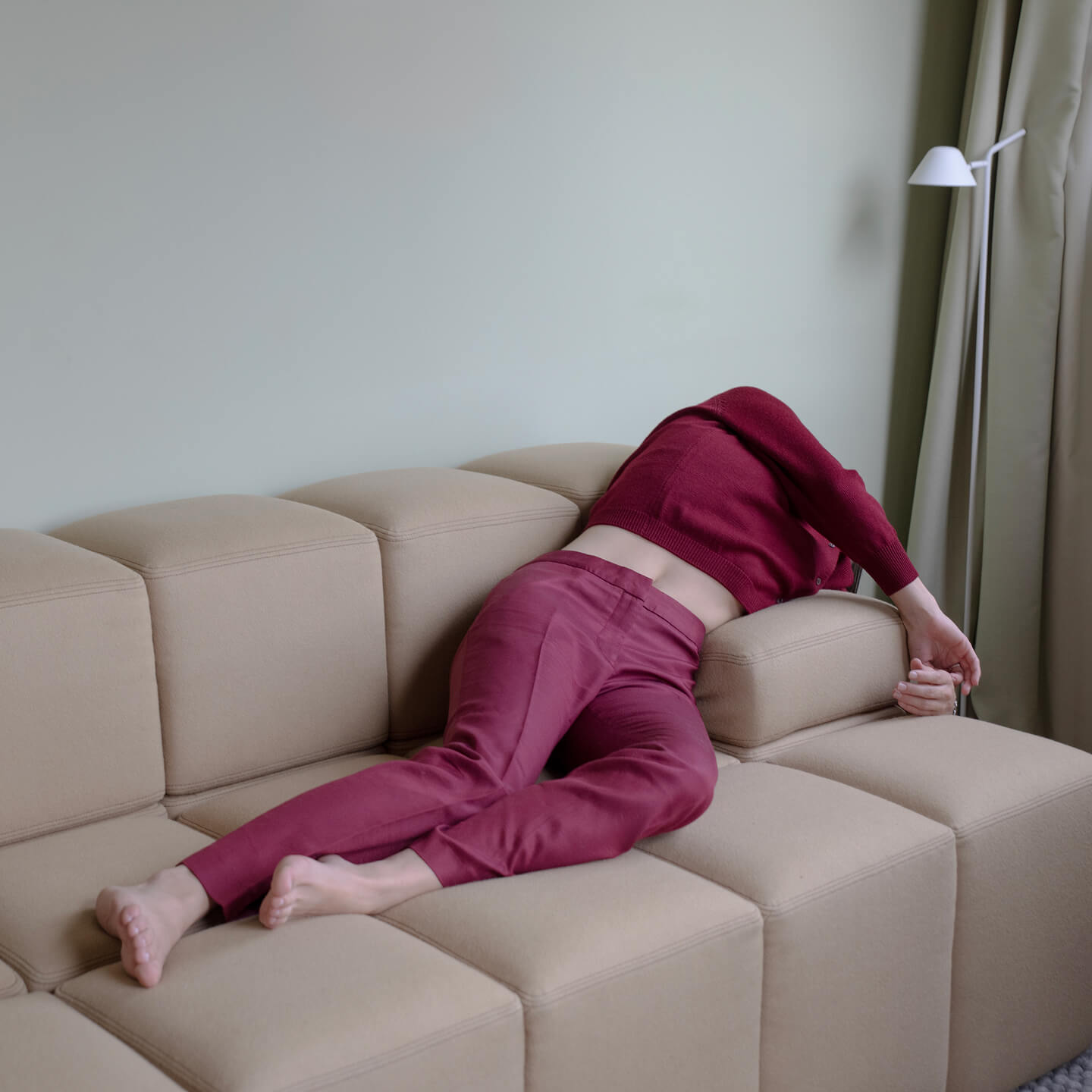 A person lounging on a sofa